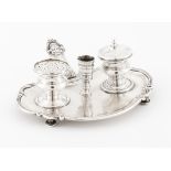 An inkwellPossibly French silver, 19th century Scalloped stand of engraved frieze and classical mask