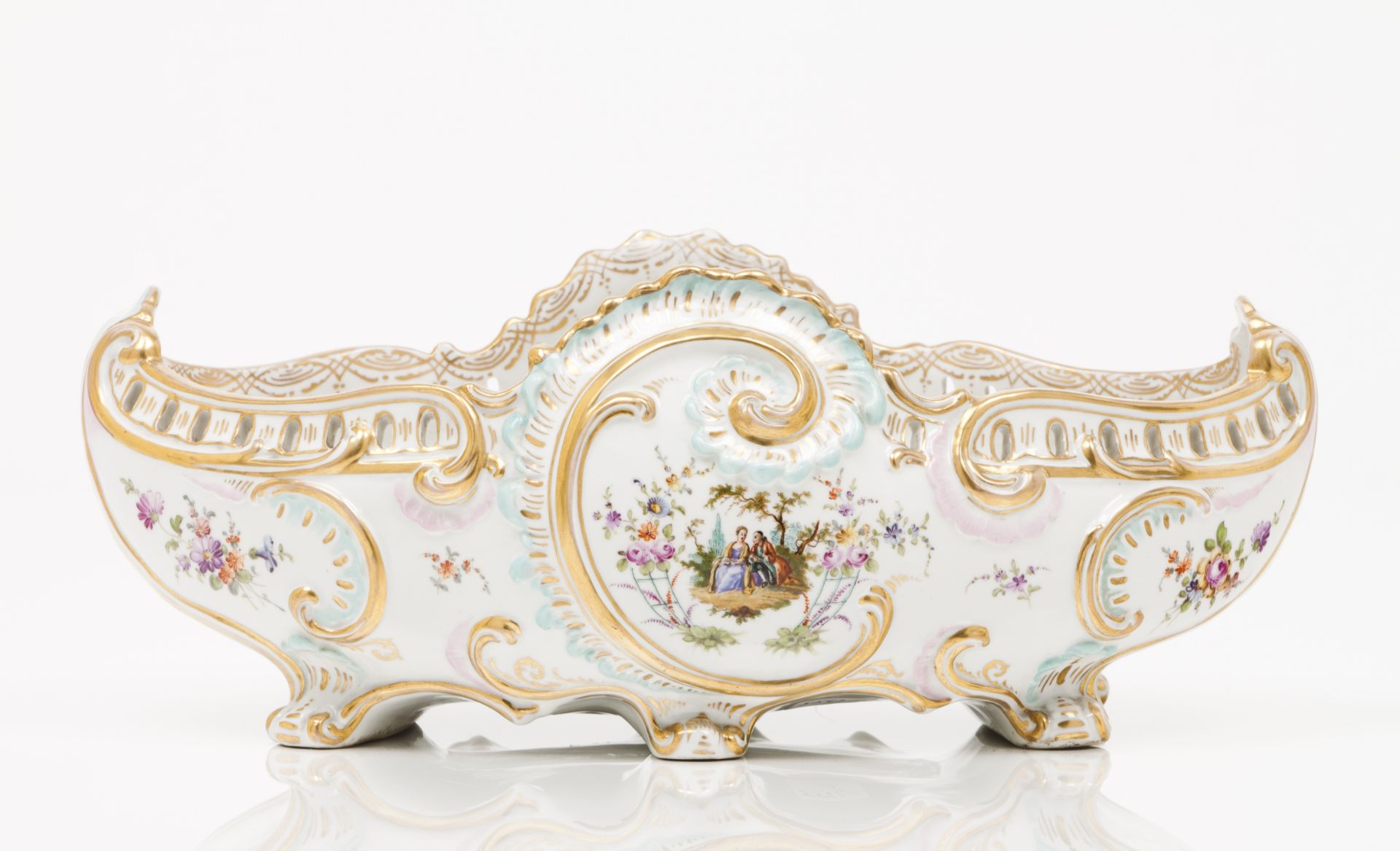 A flower bowlEuropean porcelain Polychrome and gilt decoration with putti and foliage motifs