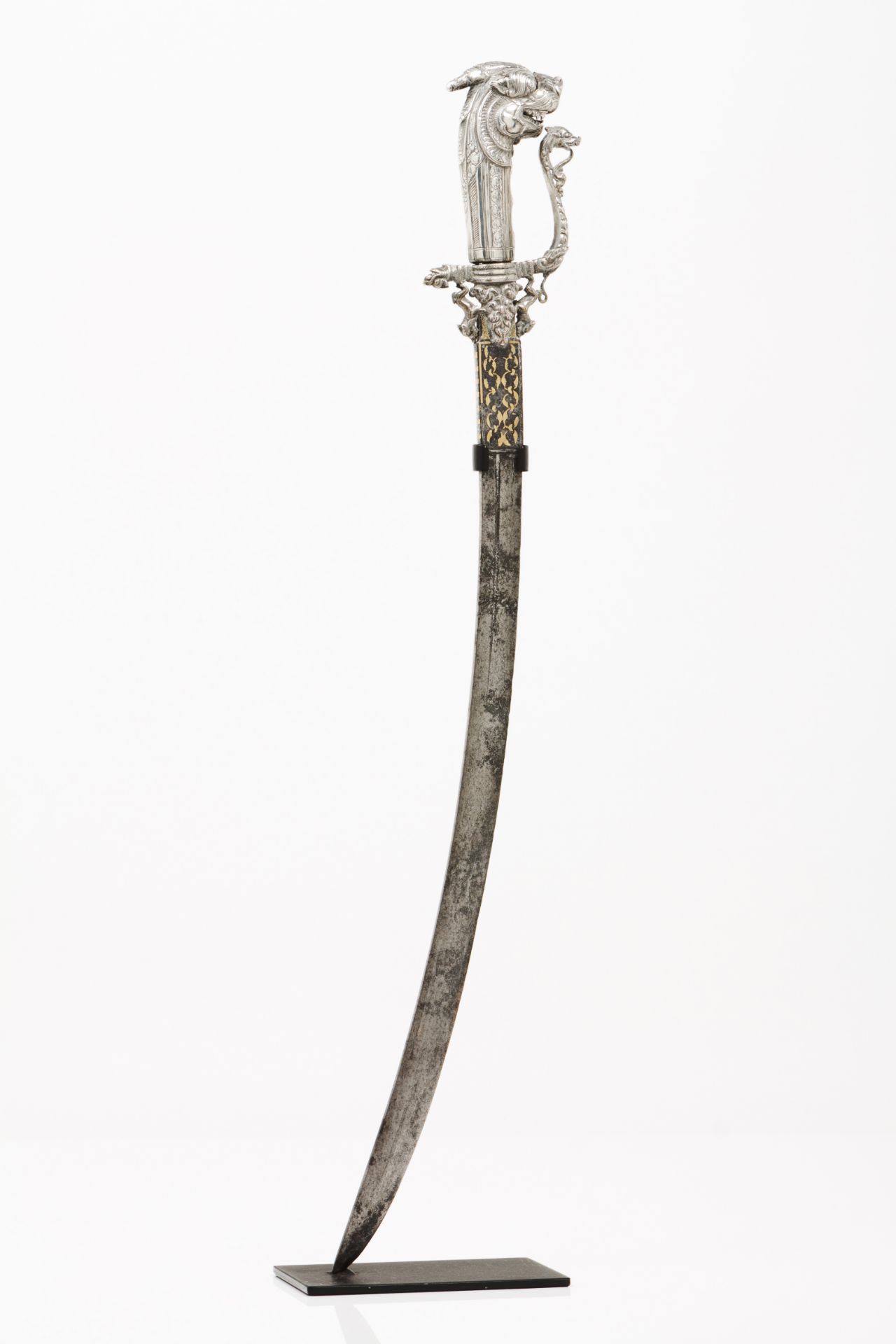 A Sinhalese sword - KastaneSilvered metal hilt of engraved and raised dragon's head Cross guard