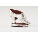 A needle cushionPortuguese silver Shaped as an 18th century shoe with bordeaux velvet cushions