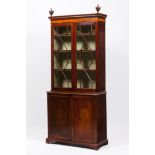 A GEORGE III BOOKCASEBrazilian mahogany, decorated with rosewood, kingwood and thornbush marquetry