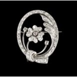 A broochGold and platinum Flower and leaves set with 57 8/8 cut diamonds totalling (1.00ct)