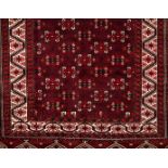 A Bukhara rug, IranWool and cotton Geometric pattern in bordeaux, beige and blue shades351x228 cm