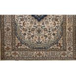 A Nain rugWool and cotton Blue and beige shades of floral pattern and central medallion (light