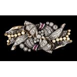 An Art Deco broochSilver and gold Stylised foliage decoration set with rose cut diamonds, pearls and