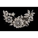 A tremblant broochSilver and Portuguese gold A two flower and foliage branch set with various