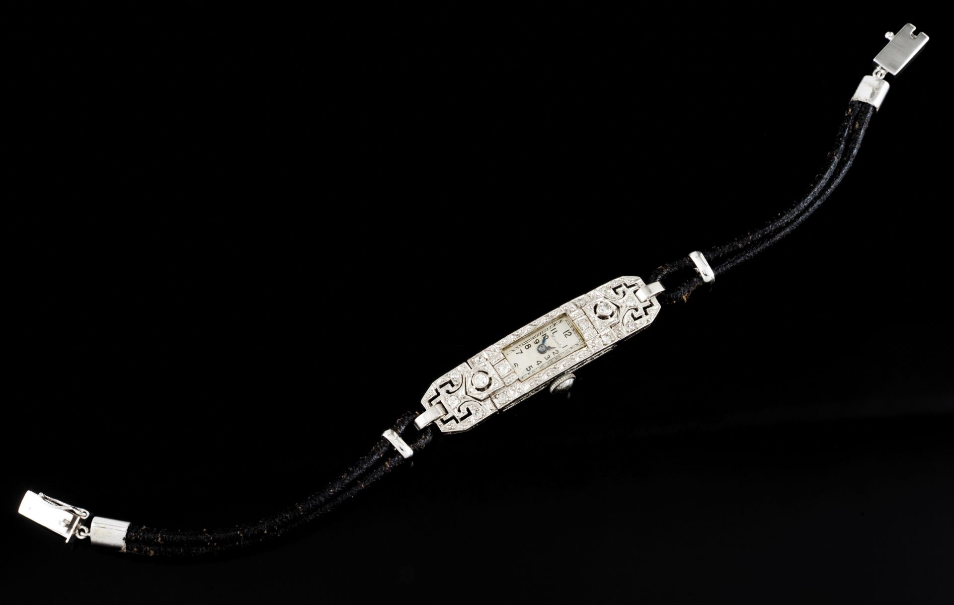 An Art Deco Nivada watchPlatinum Rectangular shaped set with two brilliant cut diamonds and