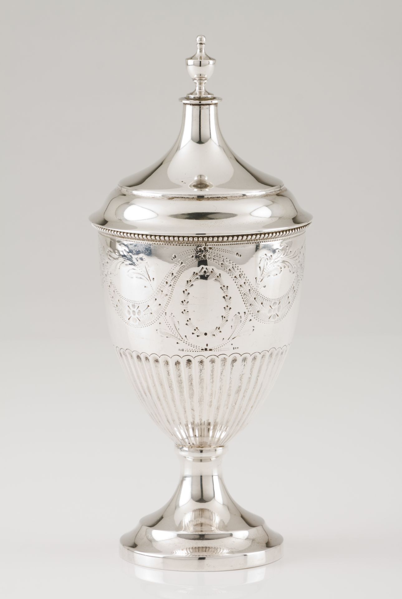 A sugar bowlPortuguese silver D.Maria style part fluted urn shaped body of engraved foliage band and