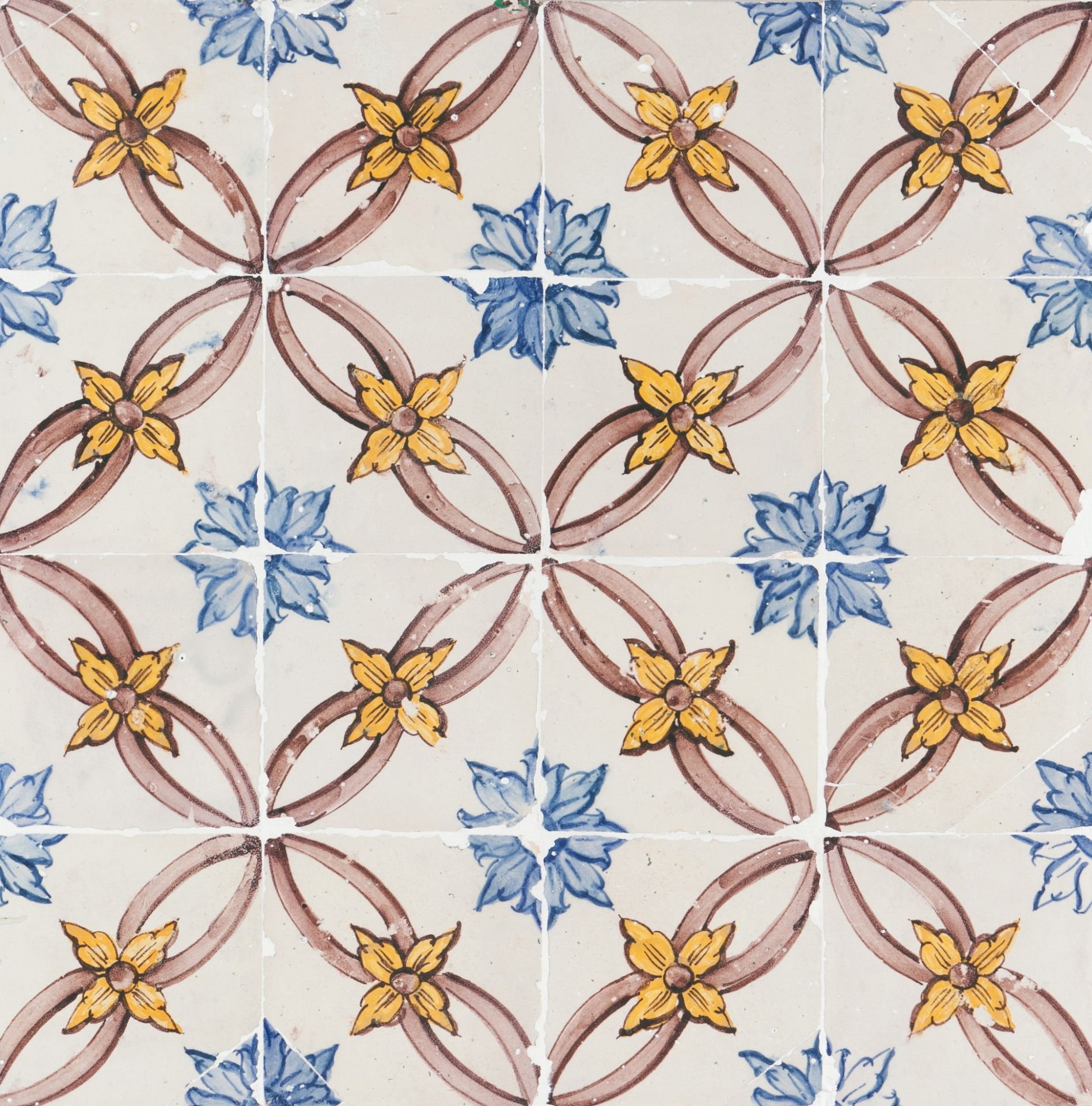 A tile panelYellow , blue and manganese "carpet pattern" decoration 16 tiles Portugal, 18th