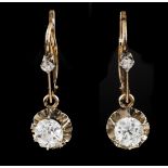 A pair of earringsGold Set with 4 Europa brilliant cut diamonds possibly colour J and Vs2 purity the