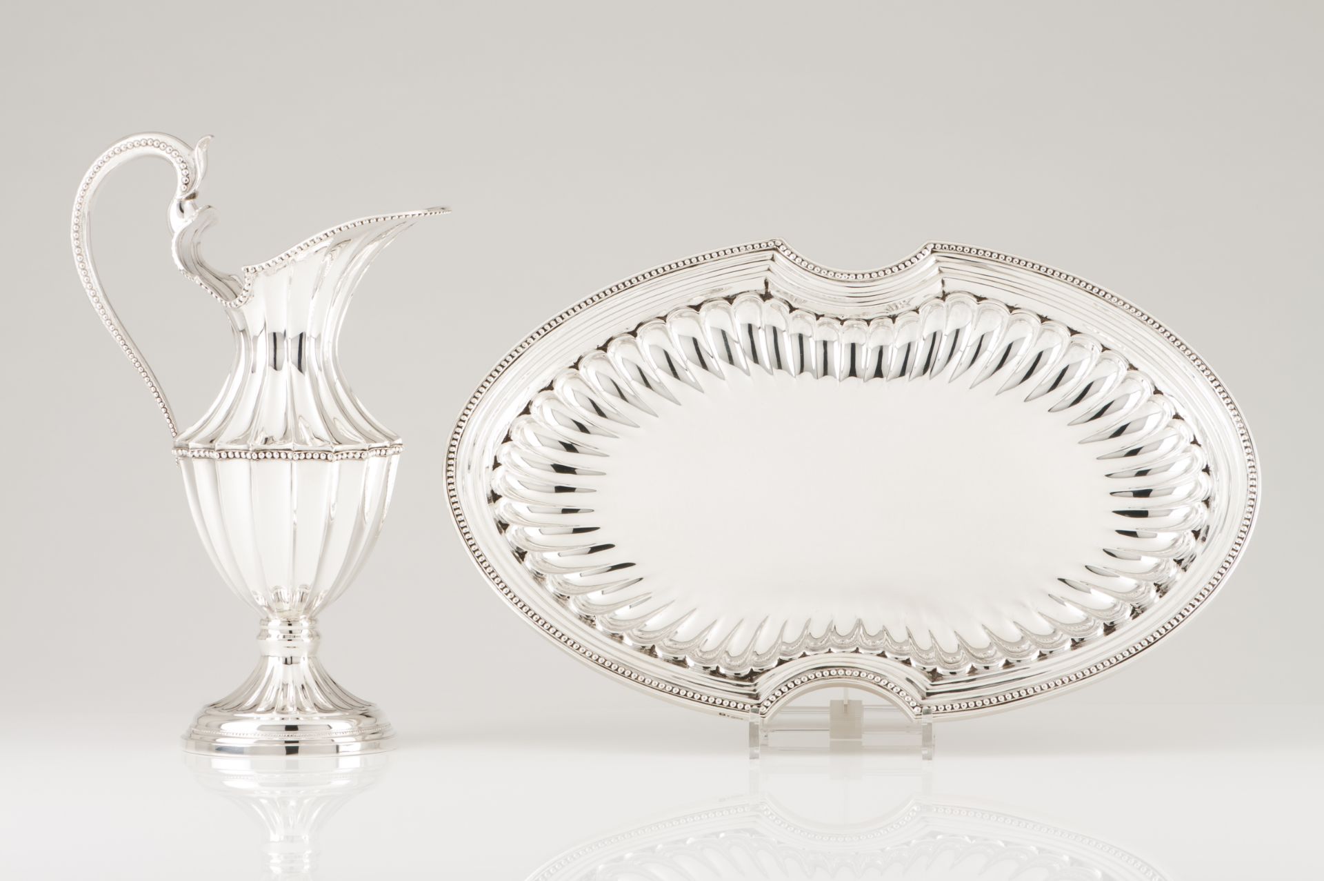 A basin and ewerPortuguese silver D.Maria style decoration of scalloped and inlaid body with