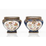 A pair of cachepotsPolychrome porcelain of floral frames decoration Gilt metal mounts France, 19th