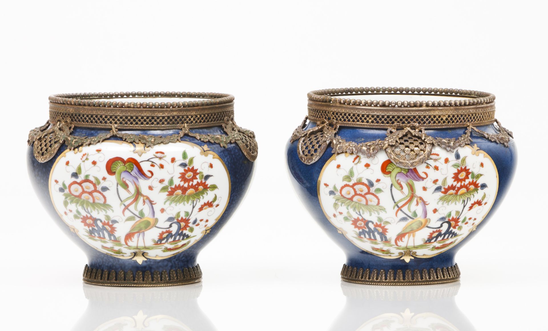 A pair of cachepotsPolychrome porcelain of floral frames decoration Gilt metal mounts France, 19th