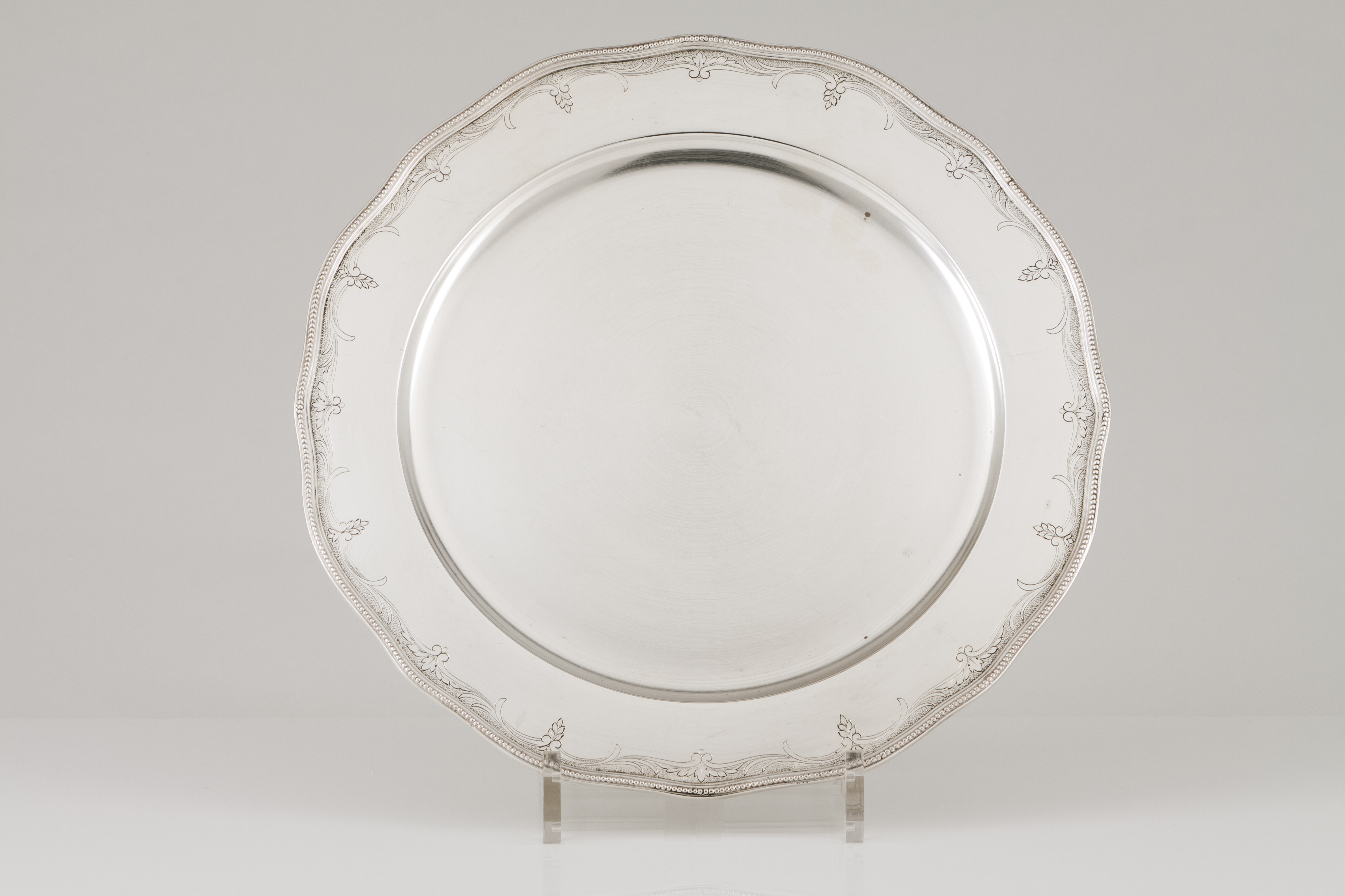 A salverPortuguese silver Plain centre of scalloped lip engraved with foliage band and beaded frieze