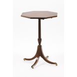 A George III style tripod tableSolid and veneered mahogany Octagonal top Striated and carved central