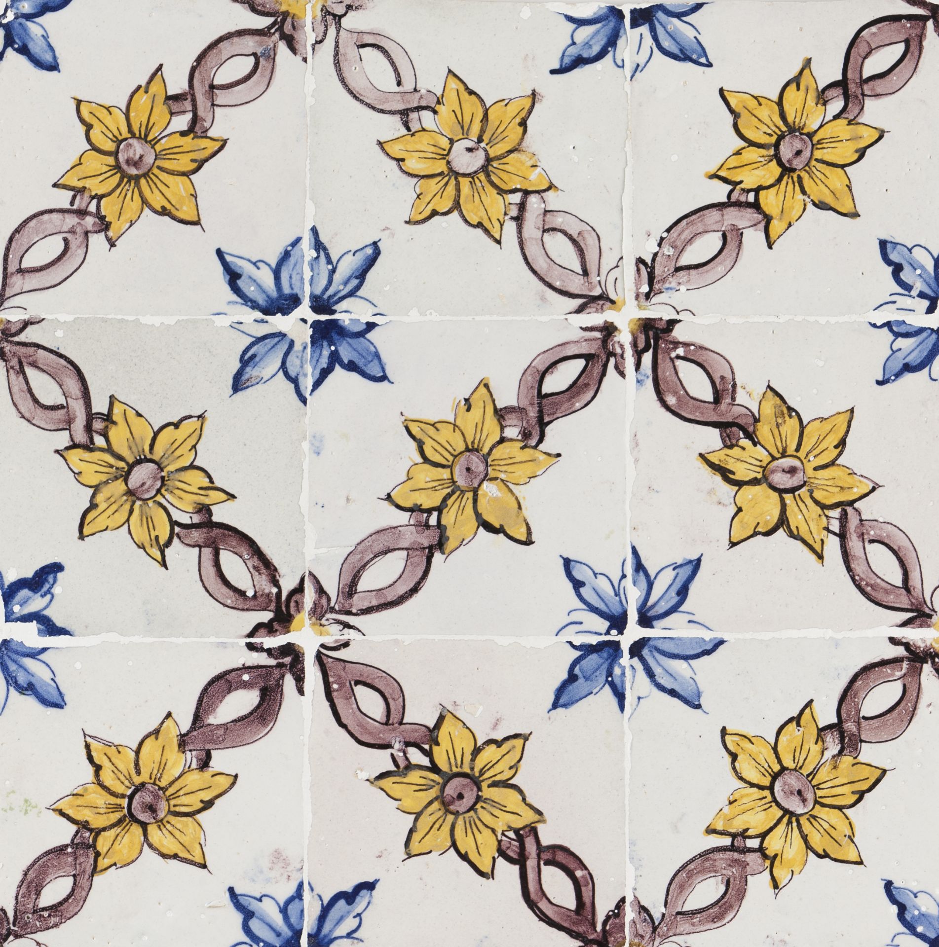 A tile panelYellow, blue and manganese floral decoration 9 tiles Portugal, 18th century (faults