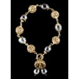 A braceletGold Pieced spheres alternating with Southern Seas grey pearls Dragon hallmark 800/1000 (