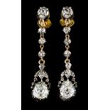 A pair of drop earringsGold and silver Set with 12 antique brilliant cut diamonds totalling (ca. 0.