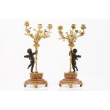 A pair of three branch candelabraGilt bronze Putti shaped shafts Marble stands 19th centuryHeight: