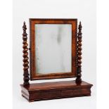 A tabletop dressing mirrorSolid, veneered and burr mahogany Turned uprights and beaded frieze mirror