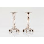 A pair of short candle sticksPortuguese silver, 19th century Turned and faceted shafts on a square