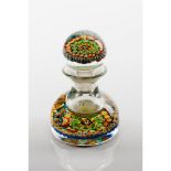 A bottle and stopperGlass paste Inner "millefiori" decoration France, 20th centuryHeight: 17 cm