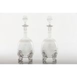 A pair of bottles and stoppersCrystal Acid etched decoration of heraldic shield for the marriage