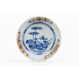 A large plateChinese export porcelain Blue decoration of central flowering garden and objects