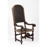 An armchairWalnut and other timbers Carved decoration Embossed leather seat and back of decorative