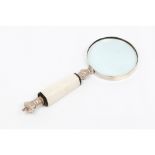 A large magnifying glassBone handle Silverer metal royal crown finial 20th century Length: 26,5 cm