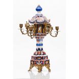 A six branch candelabraJapanese porcelain Imari decoration of foliage motifs and cranes Yellow metal