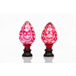 A pair of staircase finialsRed glass Metal fittings Possibly Baccarat or Saint Louis France, 19th