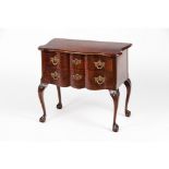 A small George II style chest of drawersMahogany and burr walnut veneer Two drawers Yellow metal