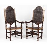 A pair of armchairsDarkened wood Embossed leather upholstery of floral motifs, figures and