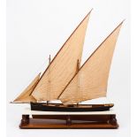 A model of the tall shipWood, textile and metal of three lateen sails Wooden display stand 20th