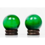 A pair of globe shadesGreen glass Darkened wood standsHeight: 19cm