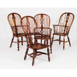 A set of four different chairs Windsor styleChestnut and other timbers Scalloped table, legs with