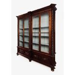 A pair of large library cabinetsChestnut Turned columns Four doors and two drawers 20th century (
