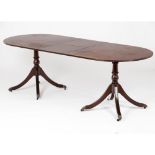 An English style dining tableSolid and veneered rosewood Claw feet and metal casters One extension