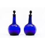 A pair of bottles and stoppersMoulded blue glass Lobate decoration Europe, 18th / 19th