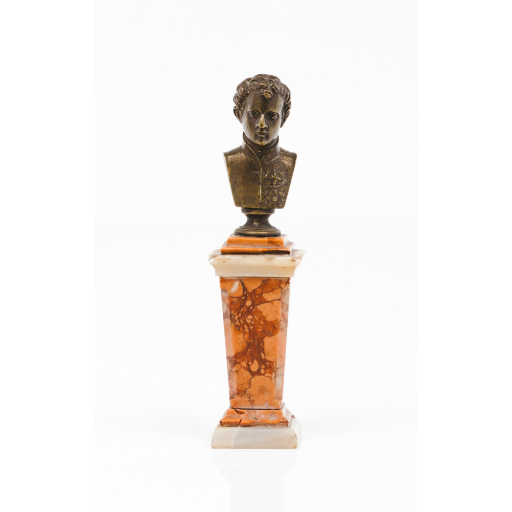 A small bustPatinated bronze on a marble column Europe, 19th century (minor losses, faults and
