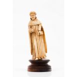 Saint AnthonyIndo-Portuguese ivory sculpture Wooden stand not original 17th century (faults)