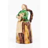A "guitar player" bottleFaience Polychrome decoration in green, brown and yellow shades Portugal,