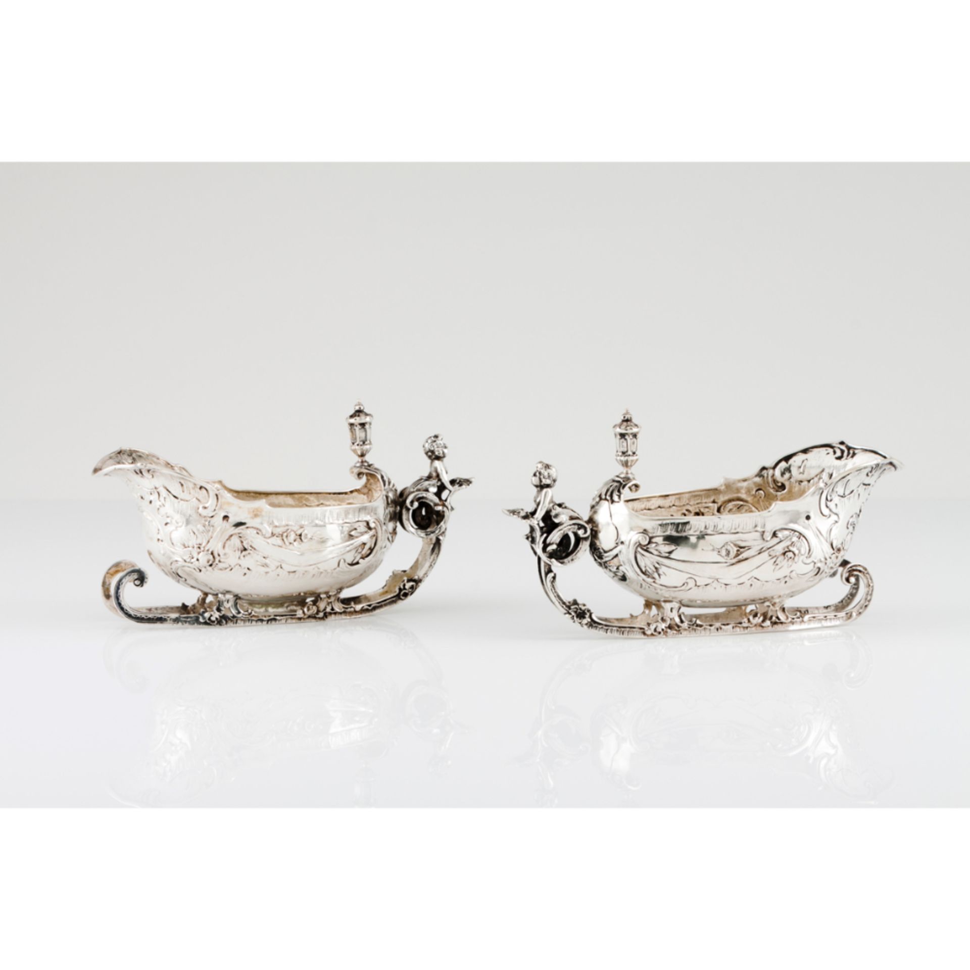 A pair of "sleigh" bowlsGerman 800/1000 silver, 19th century Foliage, acanthus and cartouche reliefs