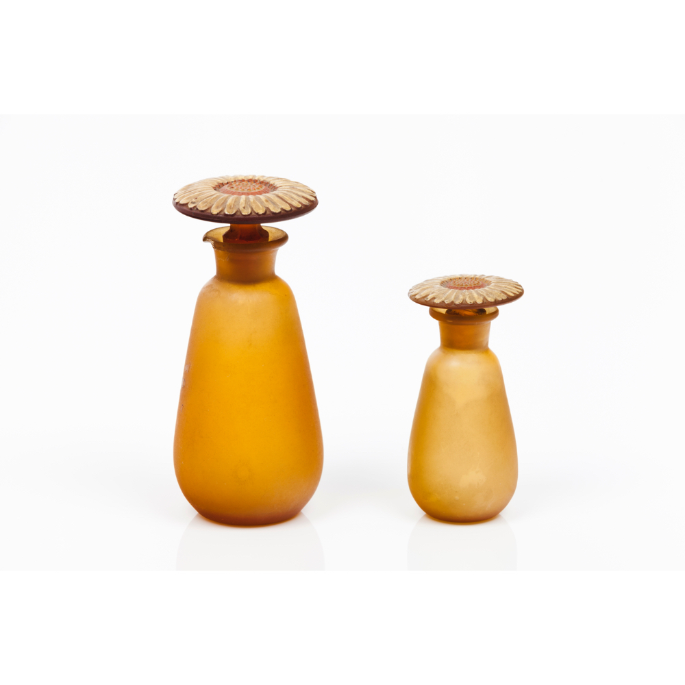 A pair of Art Nouveau bottles and stoppersGlass paste Flower shaped stoppers Europe, 19th / 20th