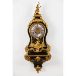 A Louis XV bracket clockEbonised wood Gilt and raised bronze mounts of foliage decoration Bronze