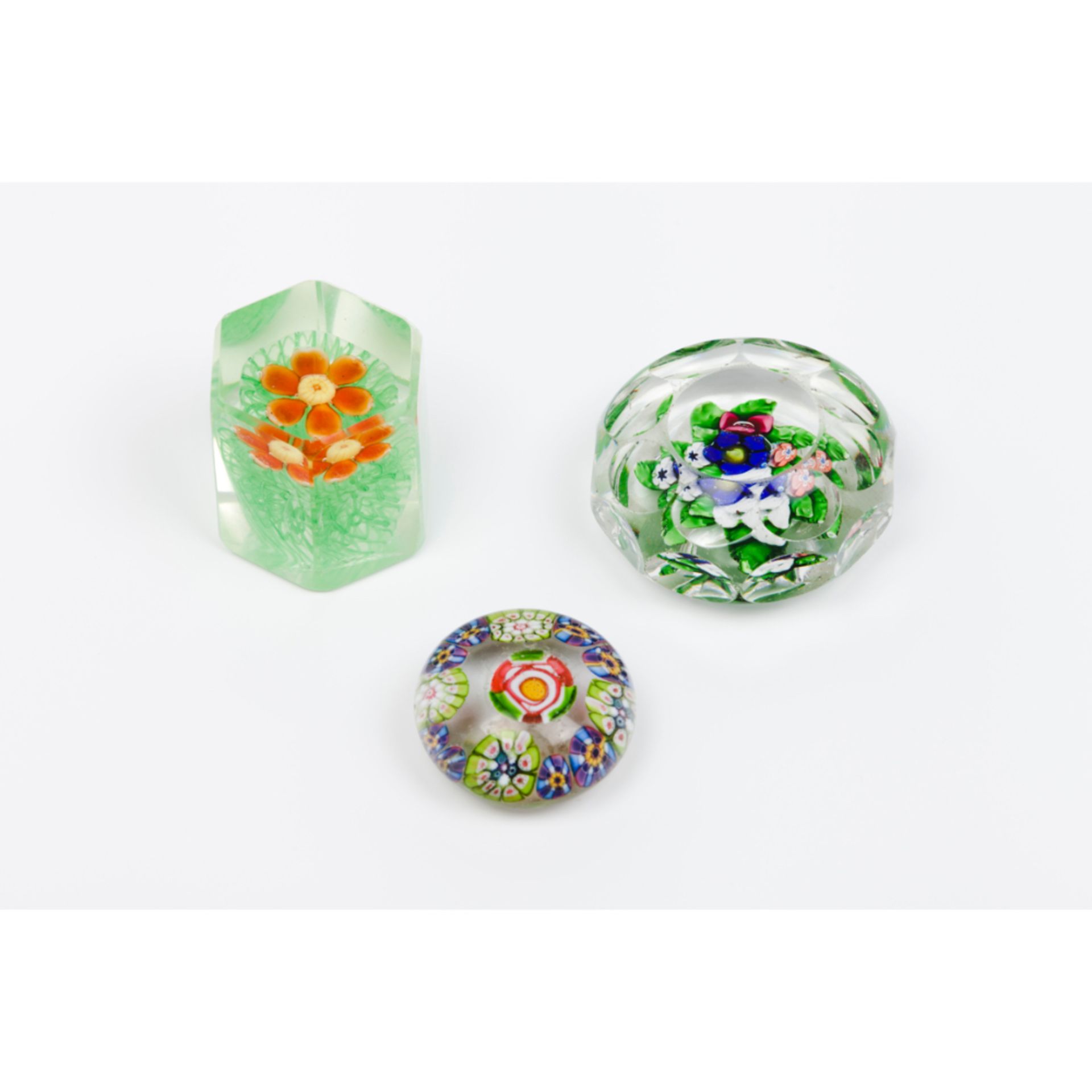 A group of three paperweightsGlass paste Inner floral decoration 20th century (losses and faults)