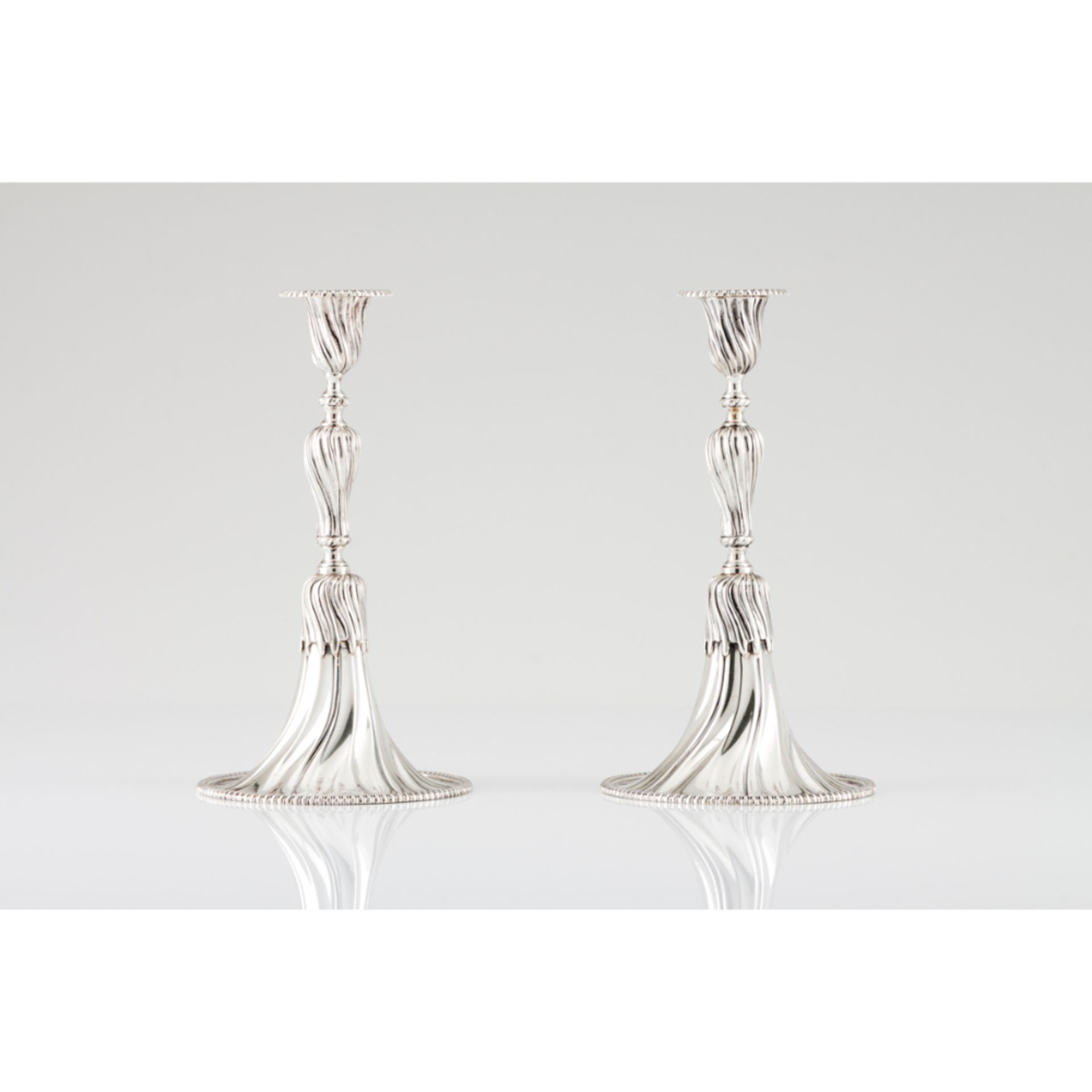 A pair of apron candlesticksPortuguese silver Spiralled decoration after 18th century prototype