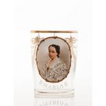 A Queen Maria II commemorative drinking glassMoulded glass of gilt garland decoration Oval medallion