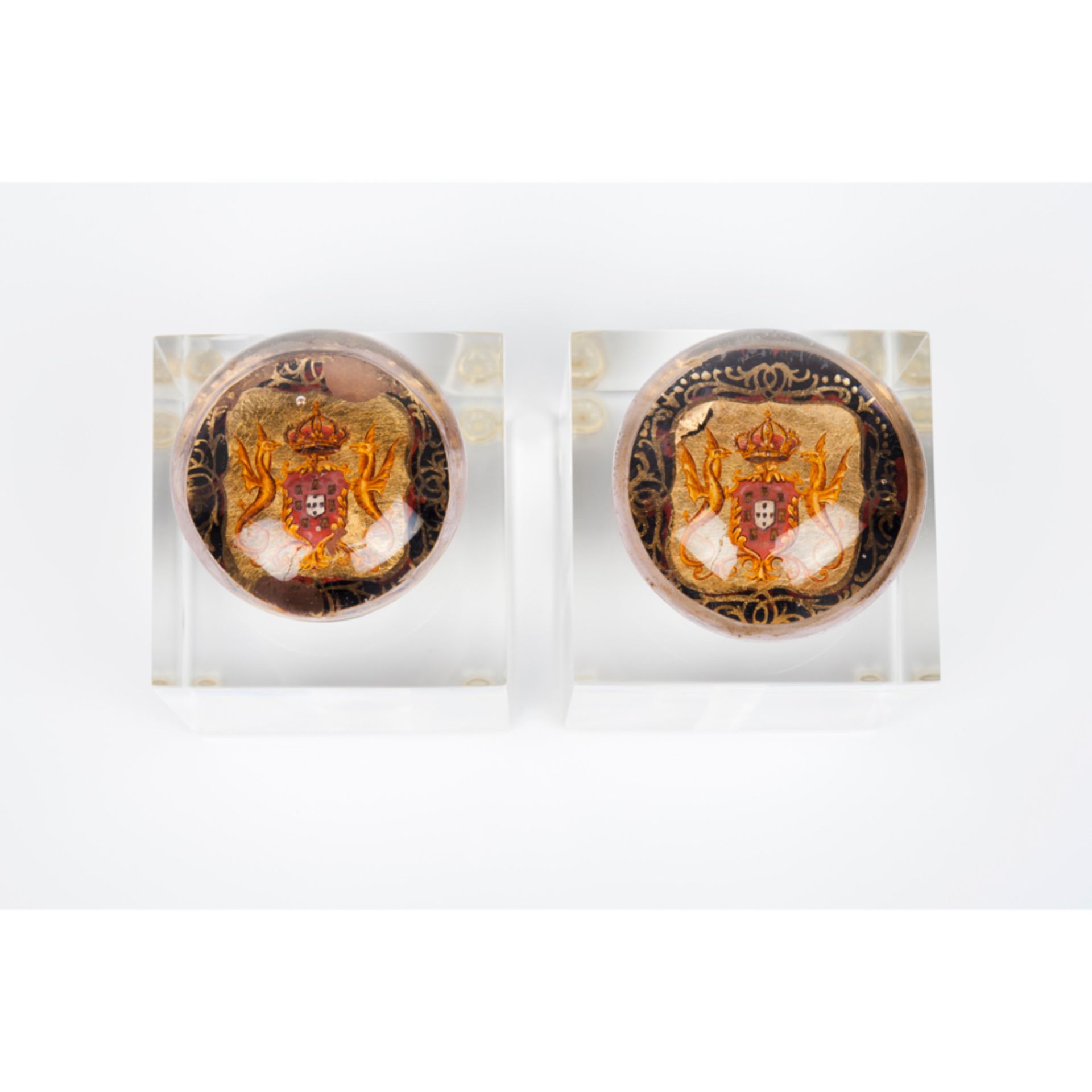 A pair of knobsMoulded glass Inner polychrome decoration with coat of arms of the Portuguese Royal